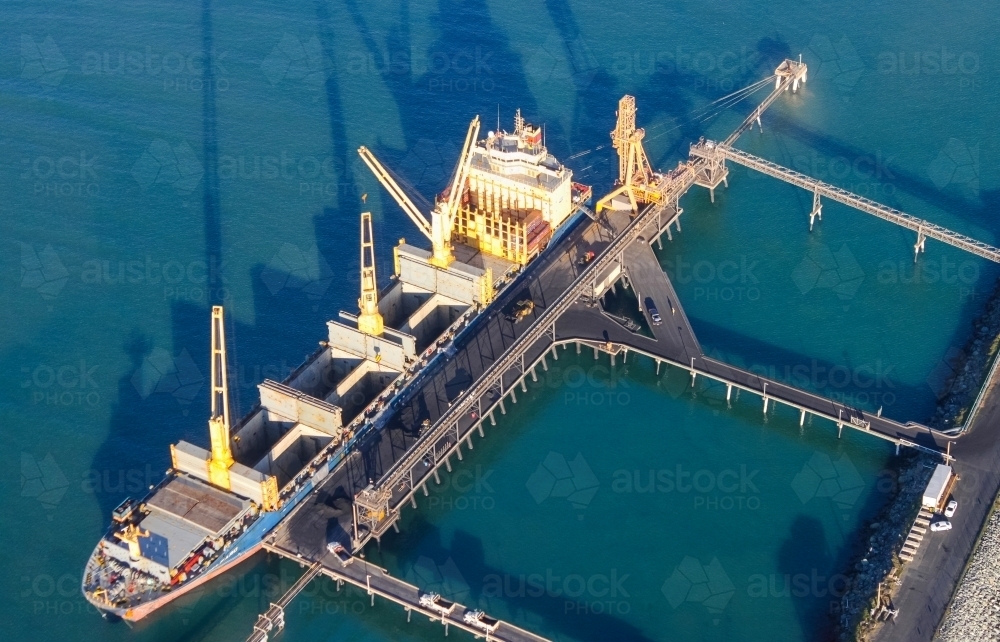 Ship laying in dock being loaded up at Mackay Port - Australian Stock Image