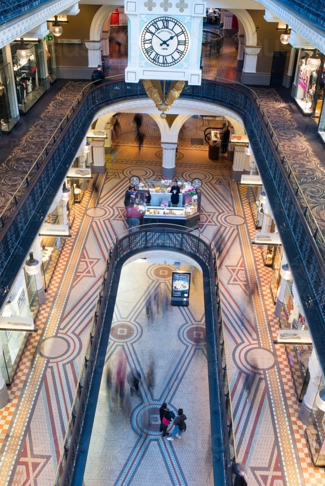 Shoppers blurred as they walk in Queen Victoria Building - Australian Stock Image