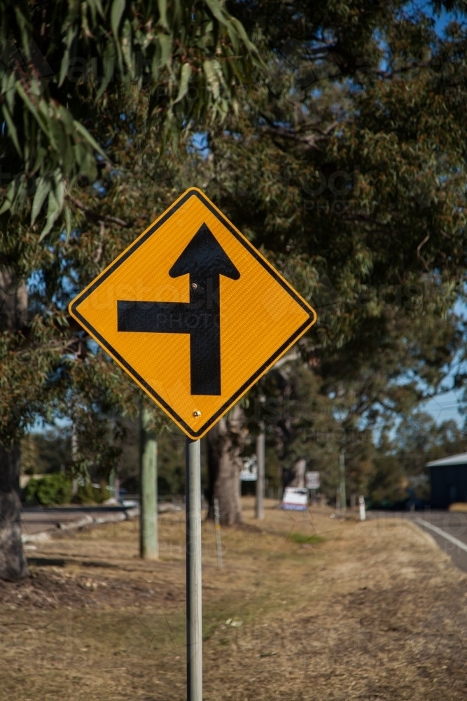 Side road ahead to the left road sign - Australian Stock Image