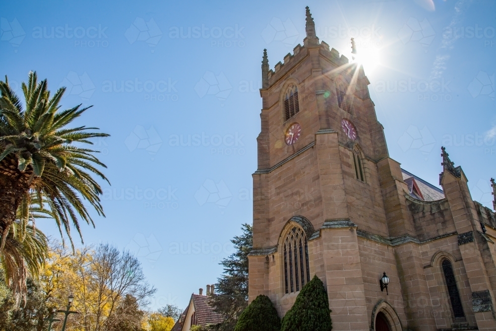 Singleton Anglican Church building with sun lens flare - Australian Stock Image