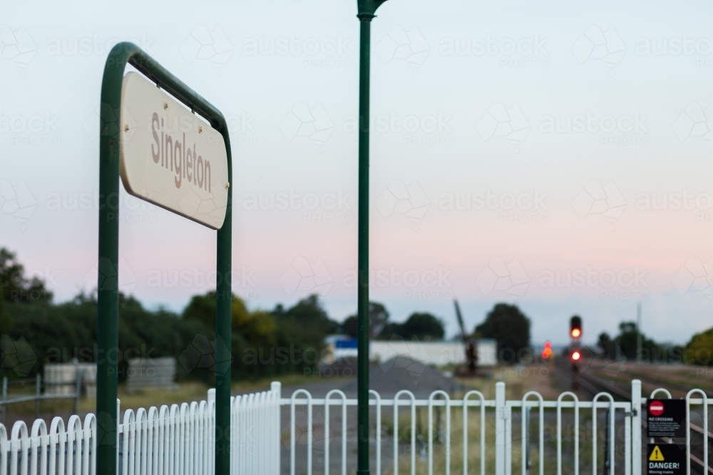 Singleton train station sign in dawn light at early commute - Australian Stock Image