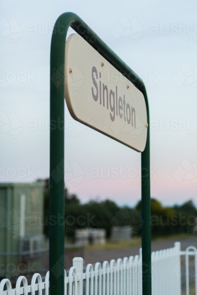 Singleton train station sign in dawn light at early commute - Australian Stock Image