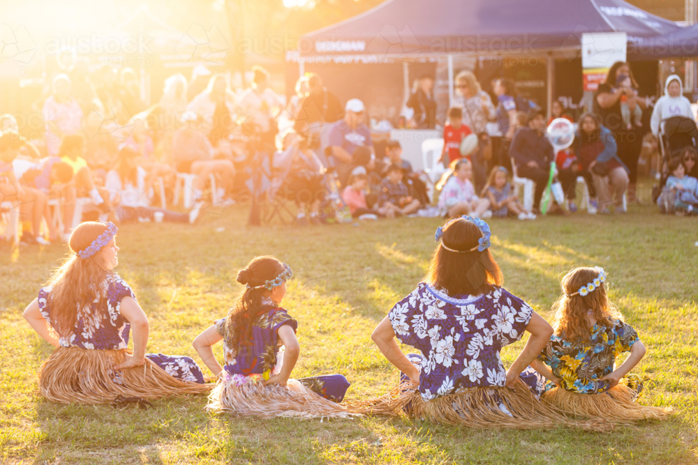 Sitting song and dance performed at cultural spectacular by Torres Strait Islander people - Australian Stock Image