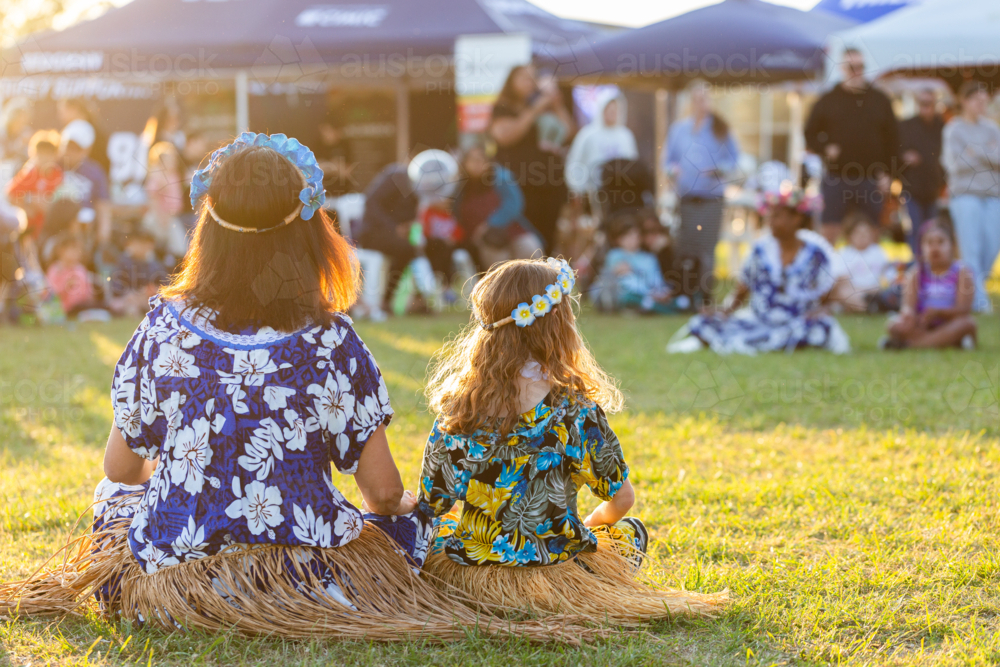 Sitting song and dance performed at cultural spectacular by Torres Strait Islander people - Australian Stock Image