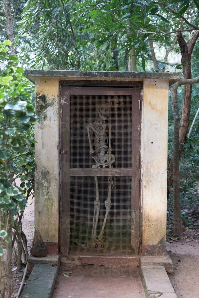 Skeleton inside the shed in the forest. - Australian Stock Image