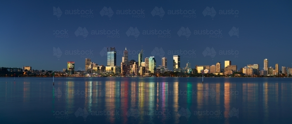 Skyline of downtown Perth, Australia at dusk, with sunset light reflecting off the skyscrapers -2021 - Australian Stock Image