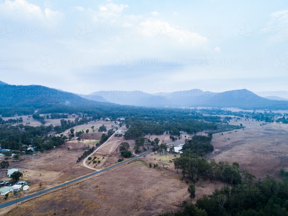 Small town of Bulga covered in smoke haze from backburning - Australian Stock Image