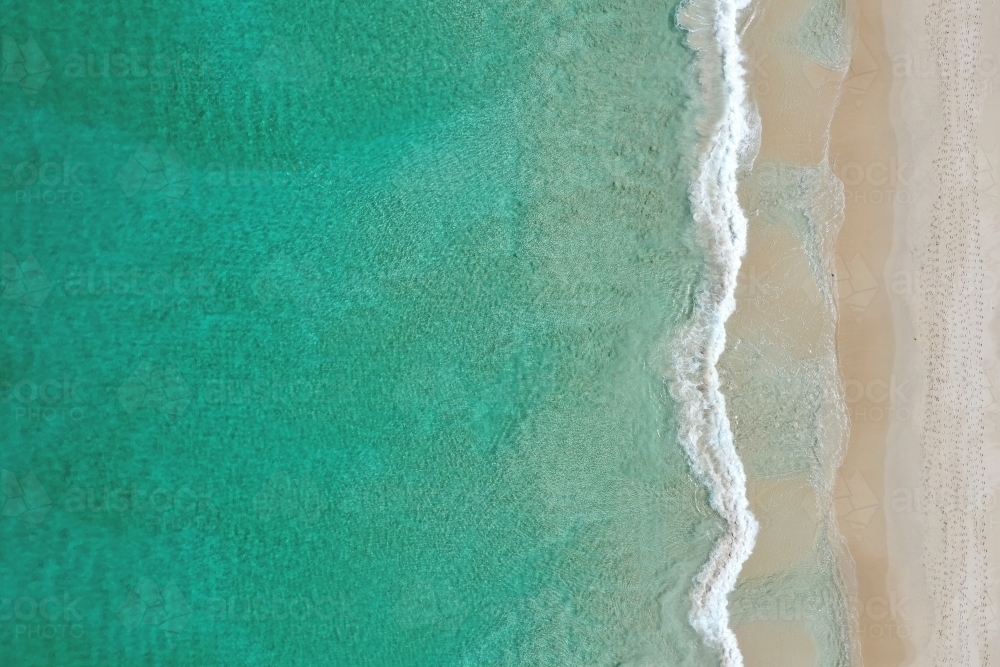 Small wave on a Perth beach in summer - Australian Stock Image