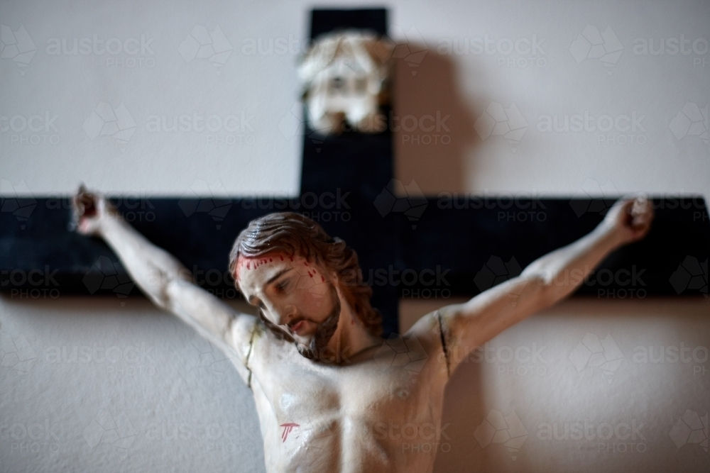 Small wooden crucifix of Jesus Christ - Australian Stock Image