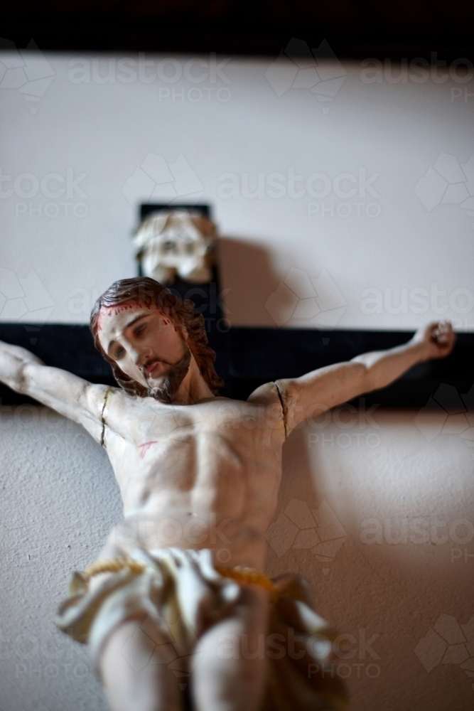 Small wooden crucifix of Jesus Christ - Australian Stock Image