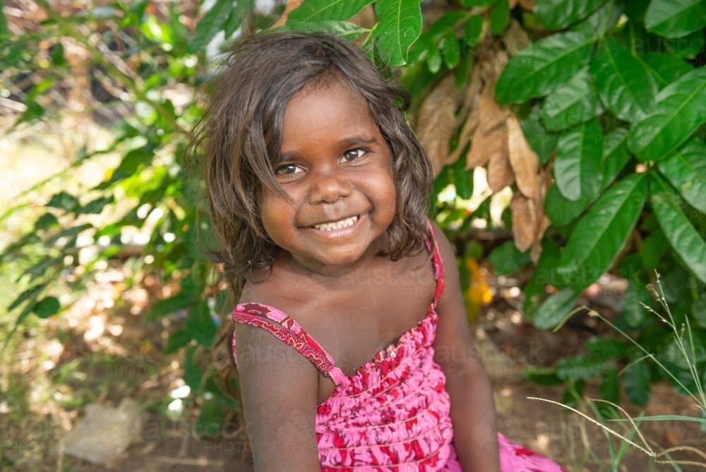 Image Of Smiling Aboriginal Girl In Garden Austockphoto