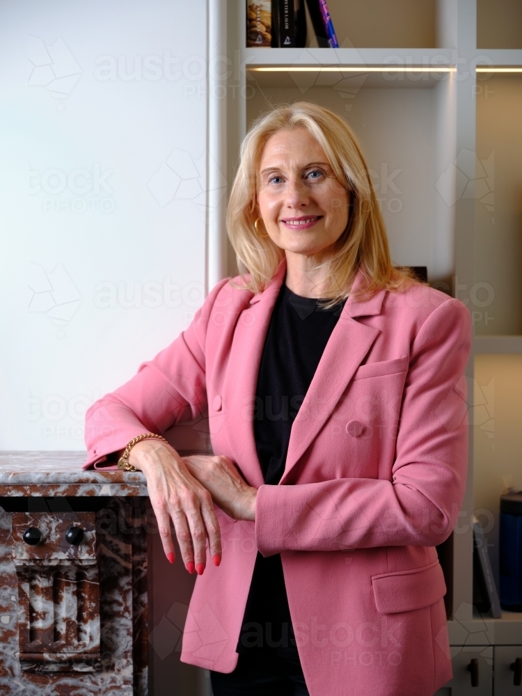 Middle aged woman in trendy pink clothing smiling at you, studio shot,  smile happy middle age blonde woman copy space 5041781 Stock Photo at  Vecteezy