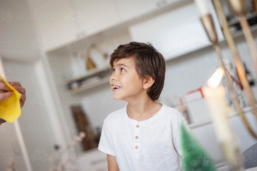 Image of Smiling boy looking upwards - Austockphoto