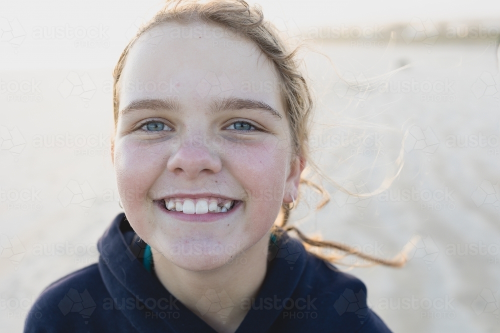 Smiling girl missing tooth - Australian Stock Image