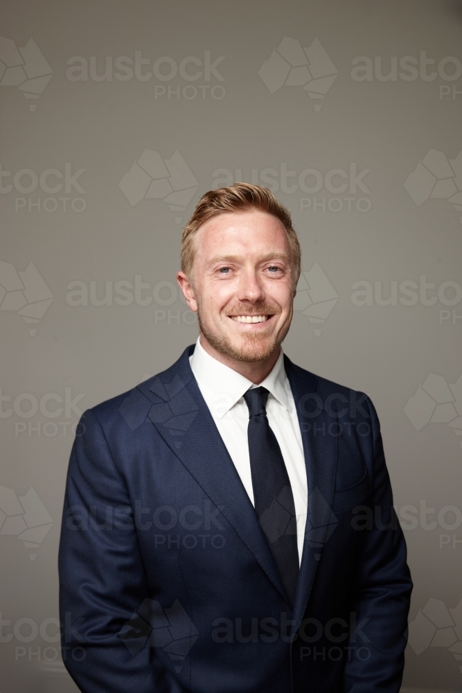 smiling middle aged man wearing suit and tie - Australian Stock Image