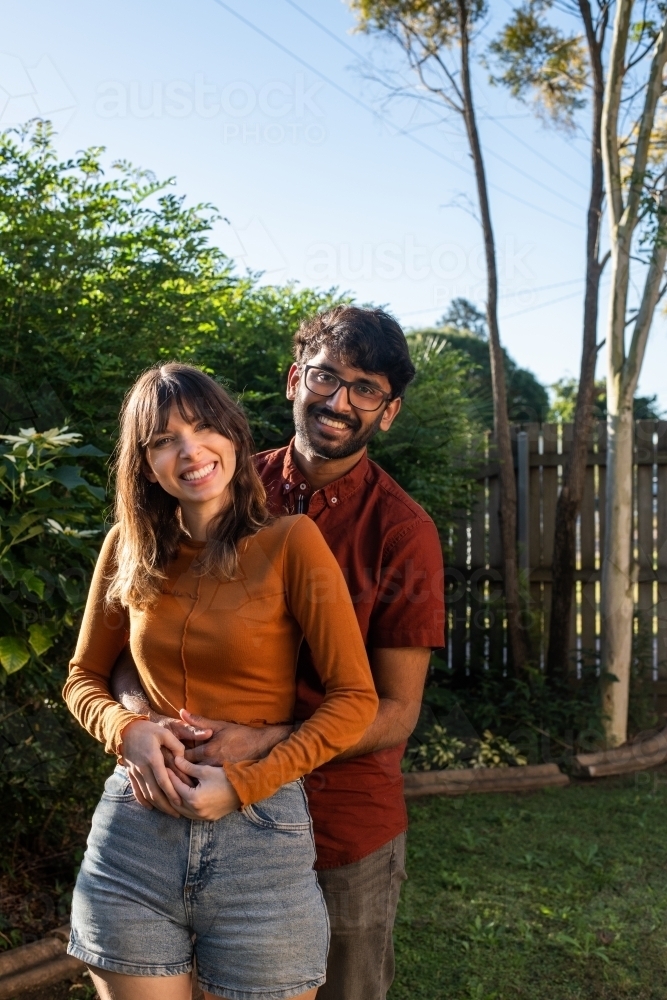 smiling mixed race couple - Australian Stock Image