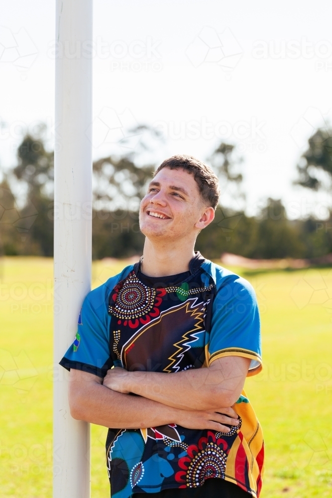 Smiling portrait of Australian teen sports person looking away - Australian Stock Image