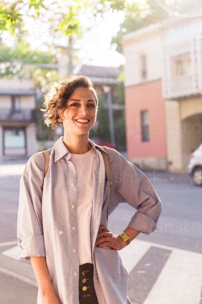 smiling woman in inner city - Australian Stock Image