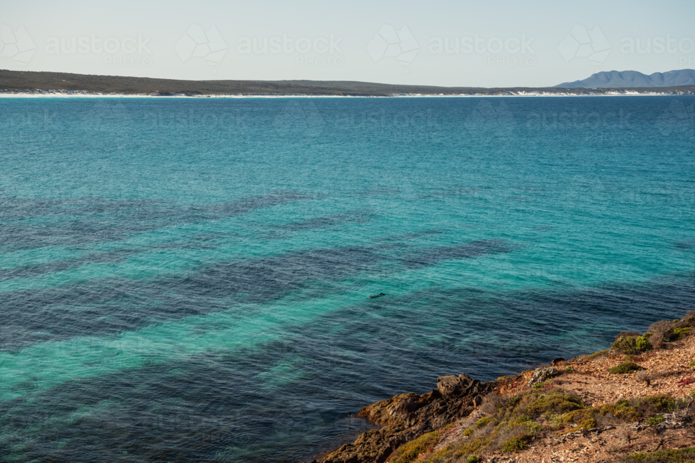 Snorkeler enjoying the waters off Point Ann - Australian Stock Image