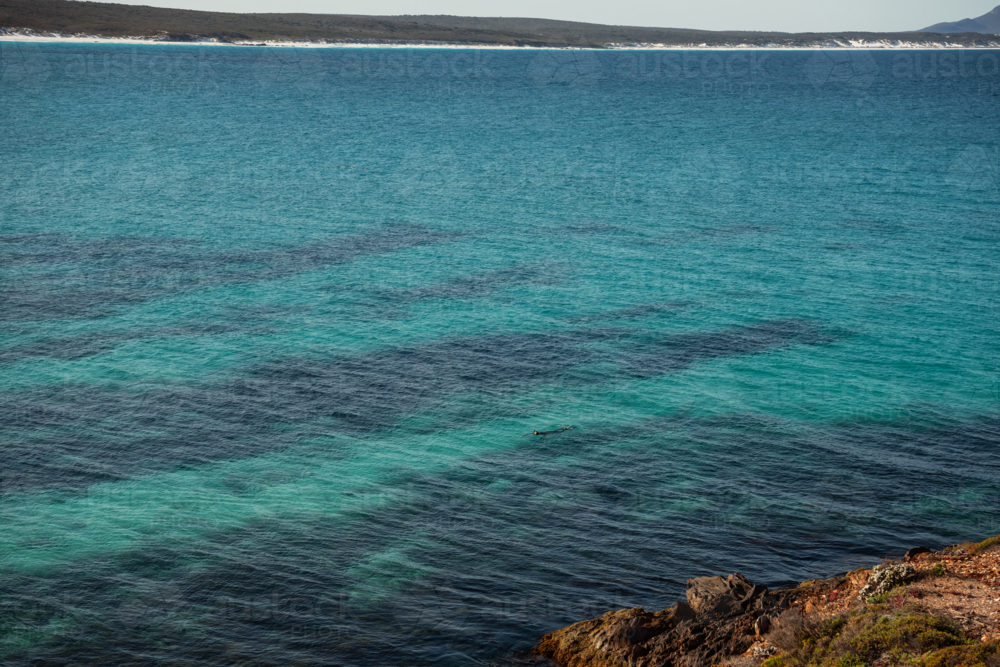 Snorkler enjoying the waters off Point Ann - Australian Stock Image