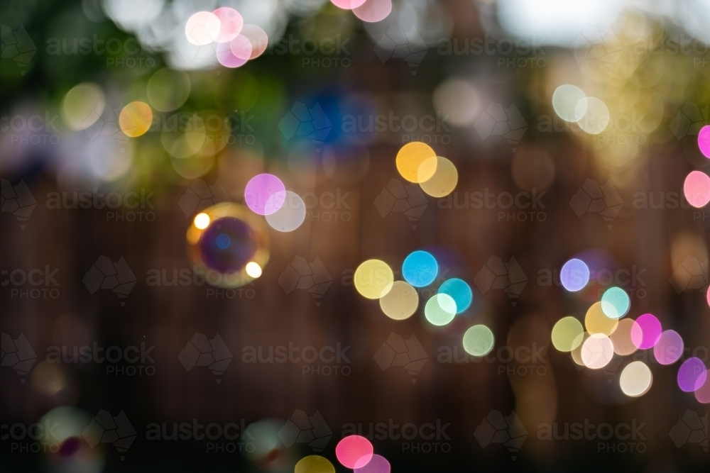 Soft focus background image of bubbles floating in golden morning sunlight - Australian Stock Image