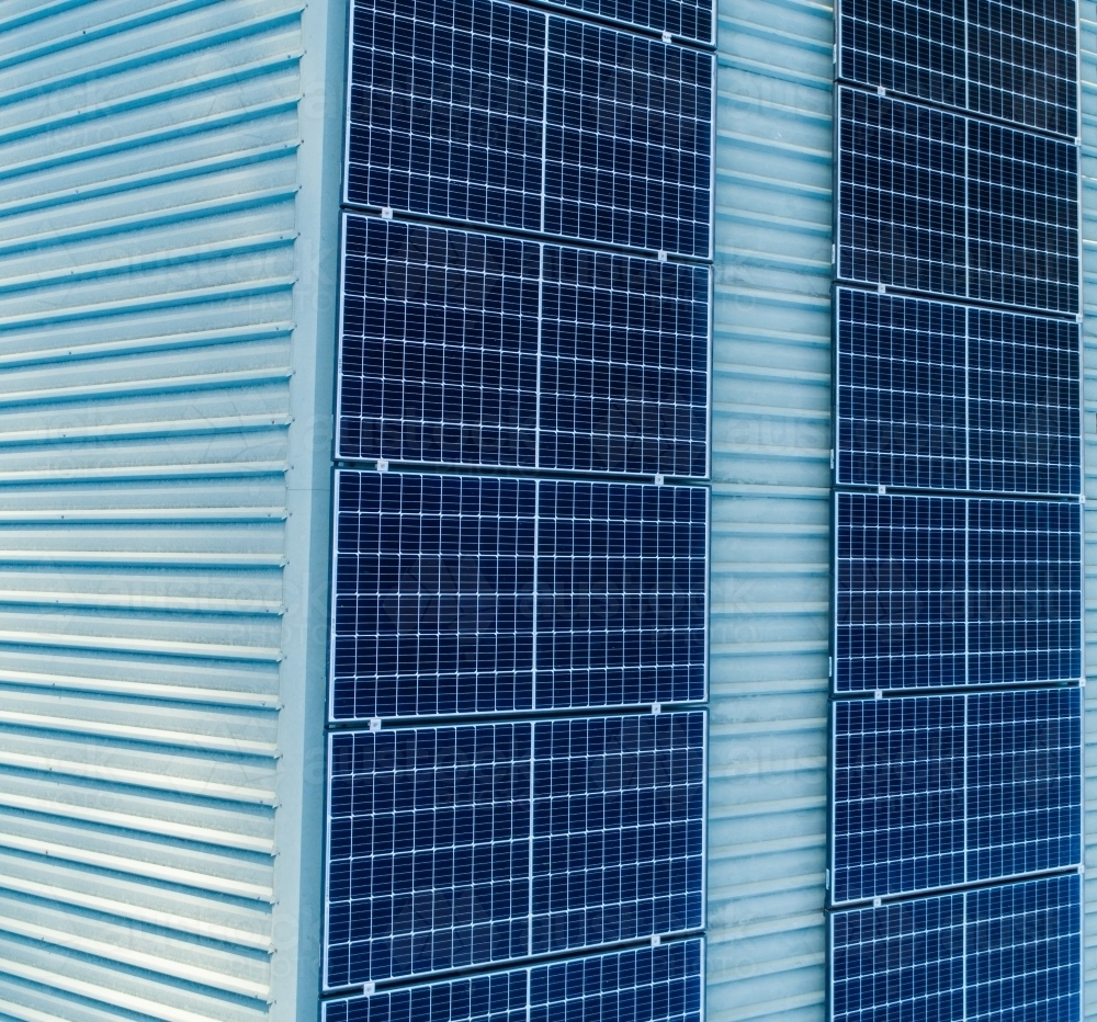 Solar panels installed on shed roof in country - Australian Stock Image