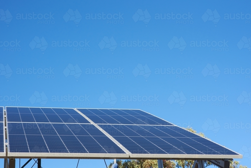 Solar panels under clear blue skies - Australian Stock Image