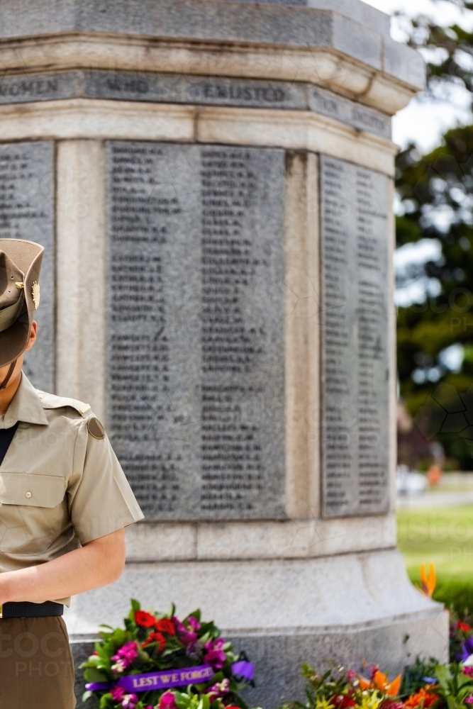 Soldier near cenotaph during remembrance day ceremony - Australian Stock Image