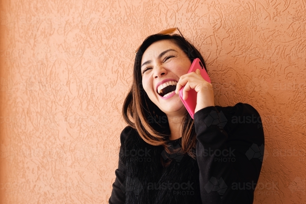 Southeast Asian multicultural woman on the phone - Australian Stock Image