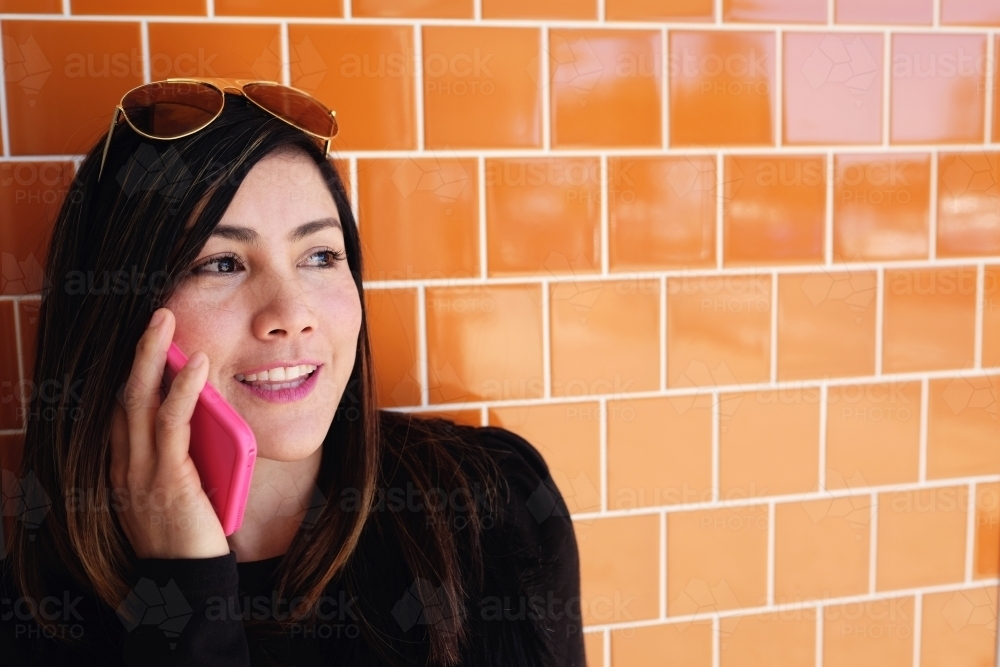 Southeast Asian multicultural woman on the phone - Australian Stock Image