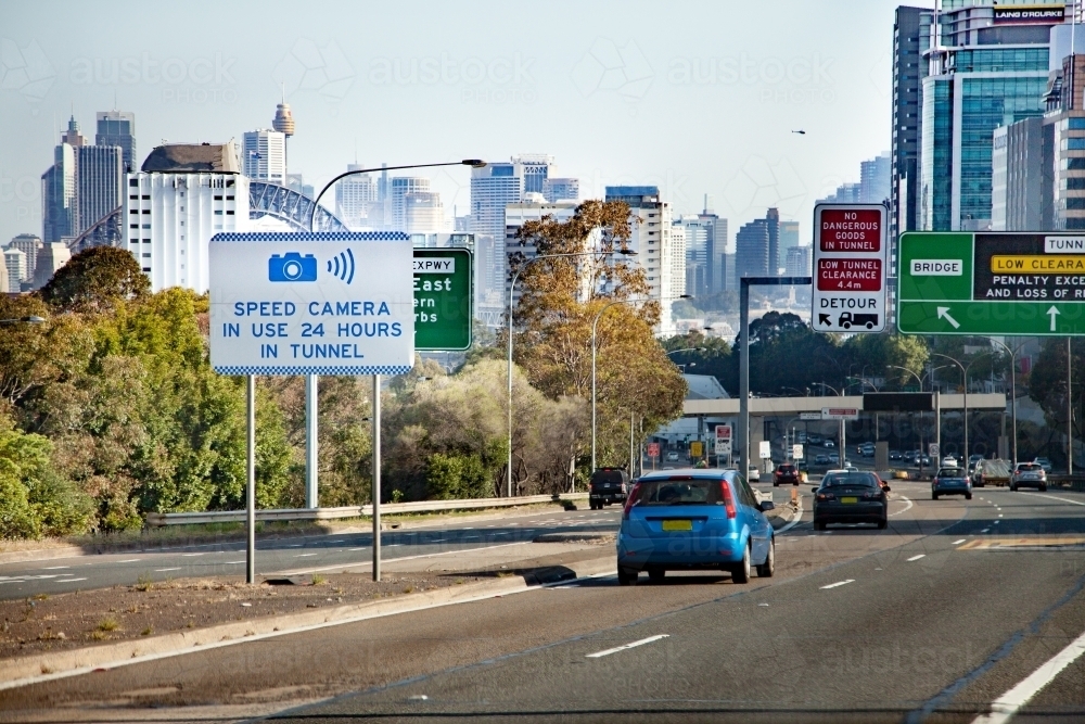 Speed camera in use 24 hours in tunnel road sign in city of Sydney - Australian Stock Image