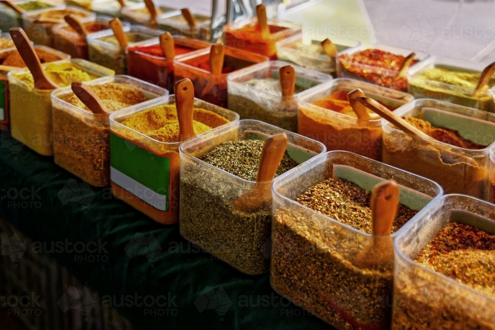 Spices for sale at market stall, parsley, coriander, chilli, turmeric - Australian Stock Image