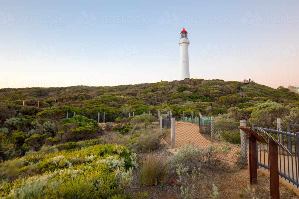 Split Point Lighthouse at dusk on a warm summer's evening in Aireys Inlet, Victoria, Australia - Australian Stock Image