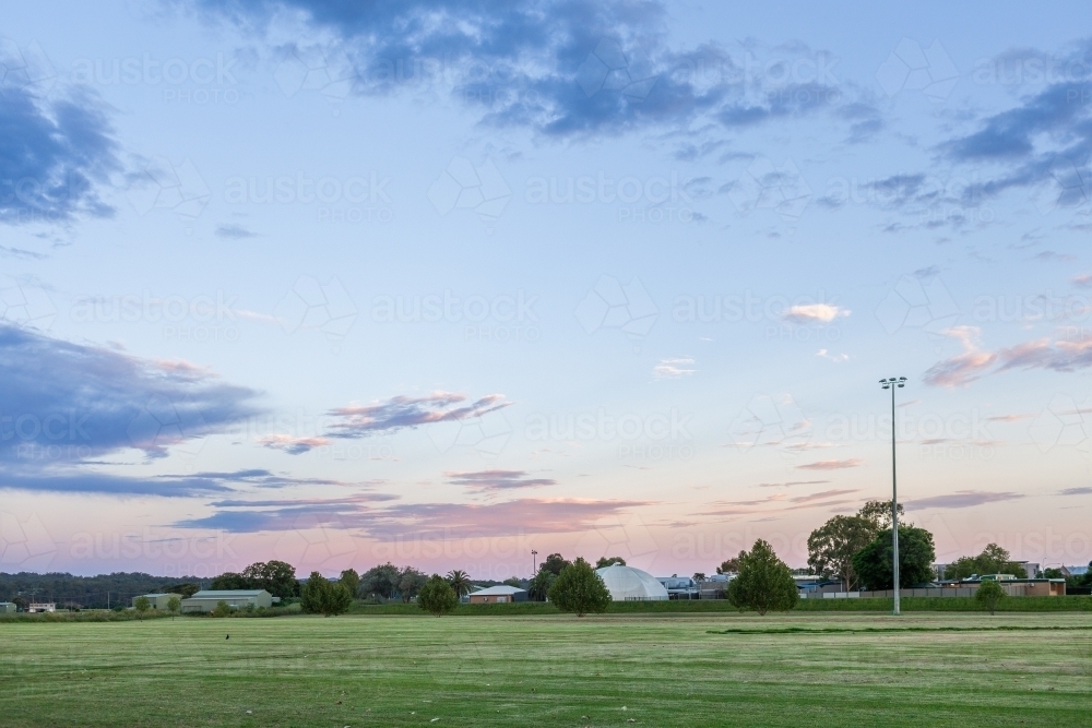 Image of Sports ground park at dusk - Austockphoto