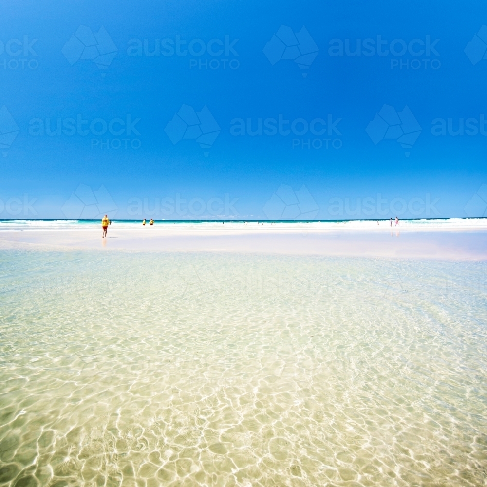 Square image of clear ocean waters with the lifesaver in the distance. - Australian Stock Image