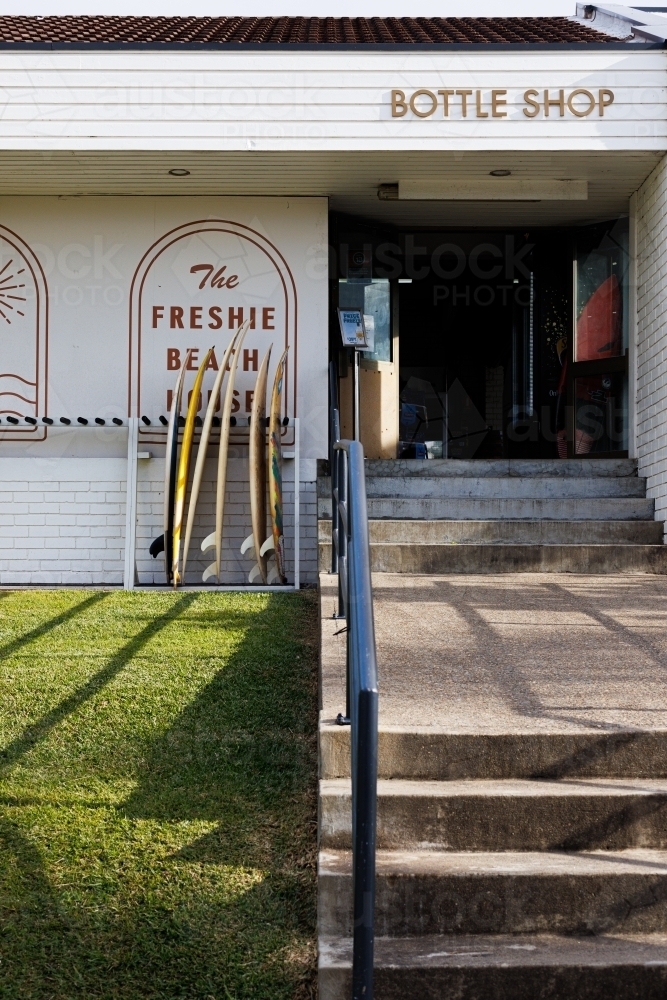 Stairway to coastal bottle shop - Australian Stock Image