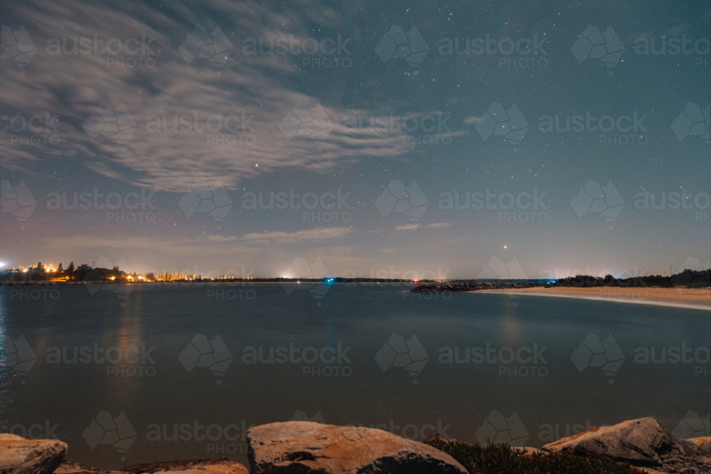 Starry night over the Iluka breakwall, long exposure astrophotography - Australian Stock Image