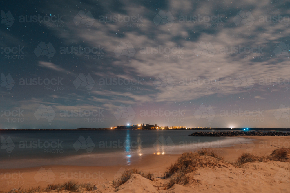 Starry night sky over Yamba NSW with pink tinge of Aurora Australis - Australian Stock Image