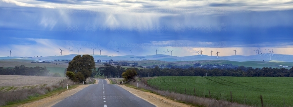 Storm clouds over wind turbines - Australian Stock Image