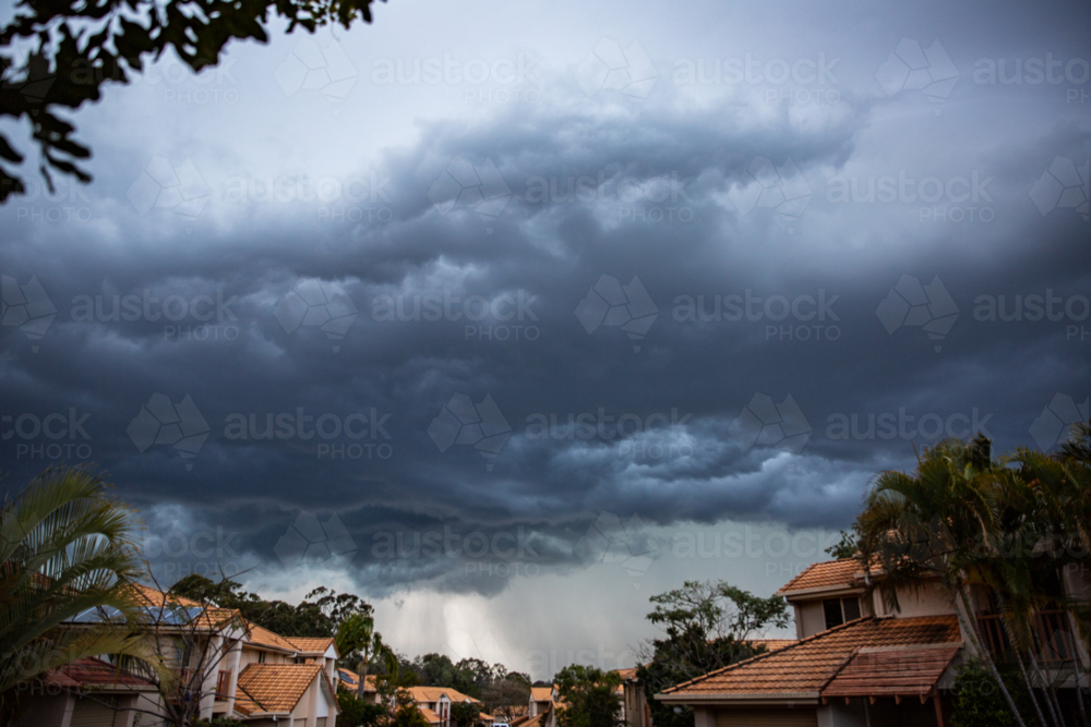 storms clouds over a housing complex in Brisbane - Australian Stock Image