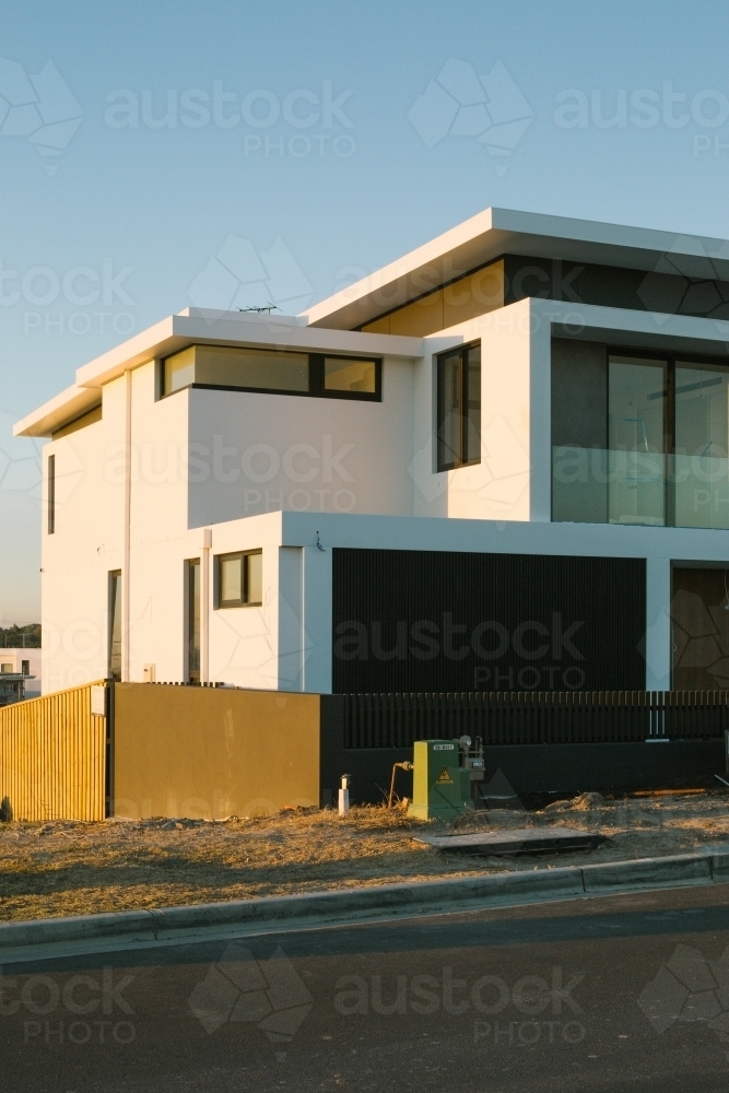 Street view of suburban housing construction development, evening light - Australian Stock Image