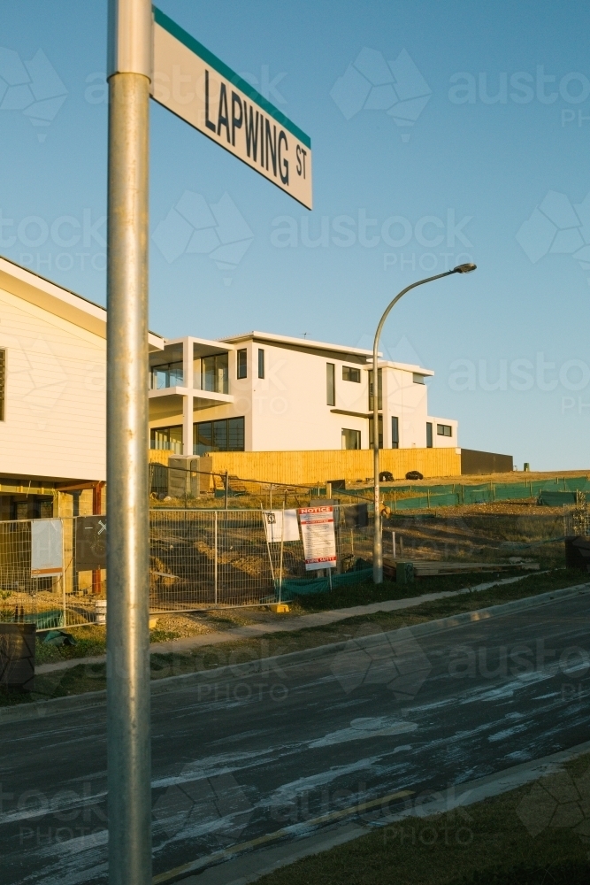 Street view of suburban housing construction development, evening light - Australian Stock Image