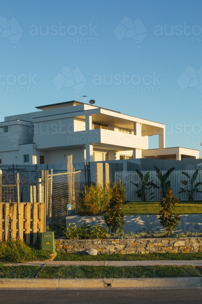 Street view of suburban housing construction development, in evening light - Australian Stock Image