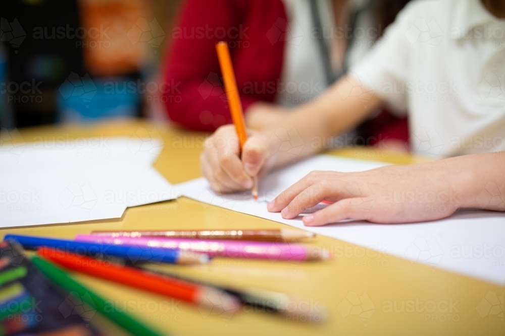 Student Drawing with Coloured Pencils - Australian Stock Image