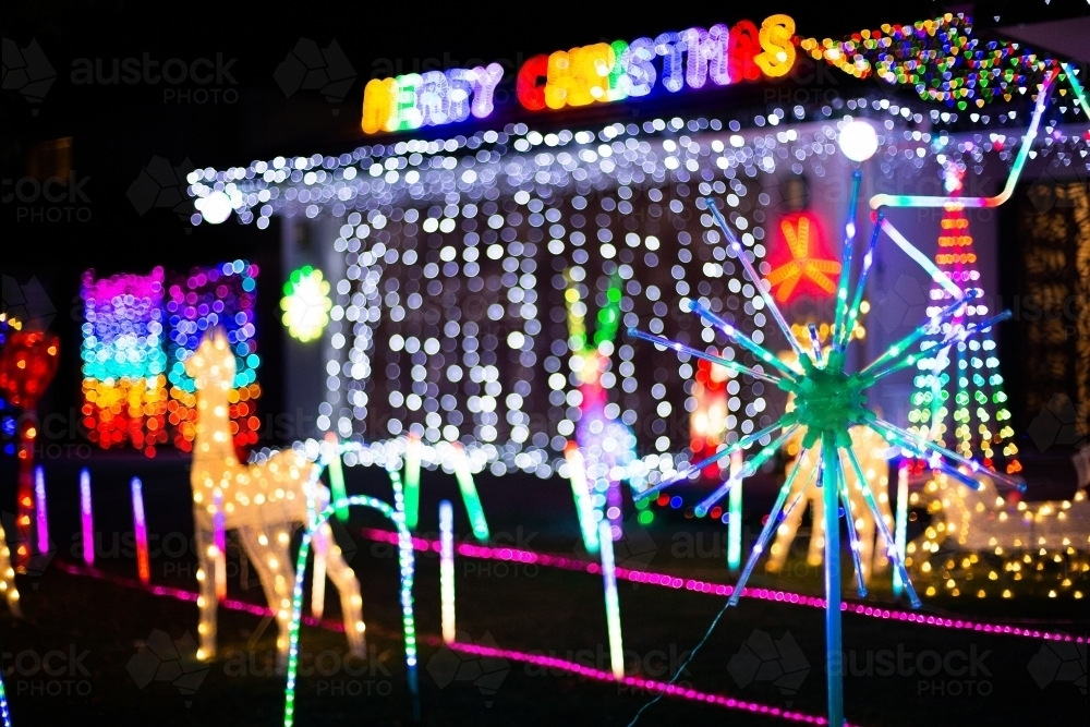 Image of suburban Christmas light display at night time Austockphoto