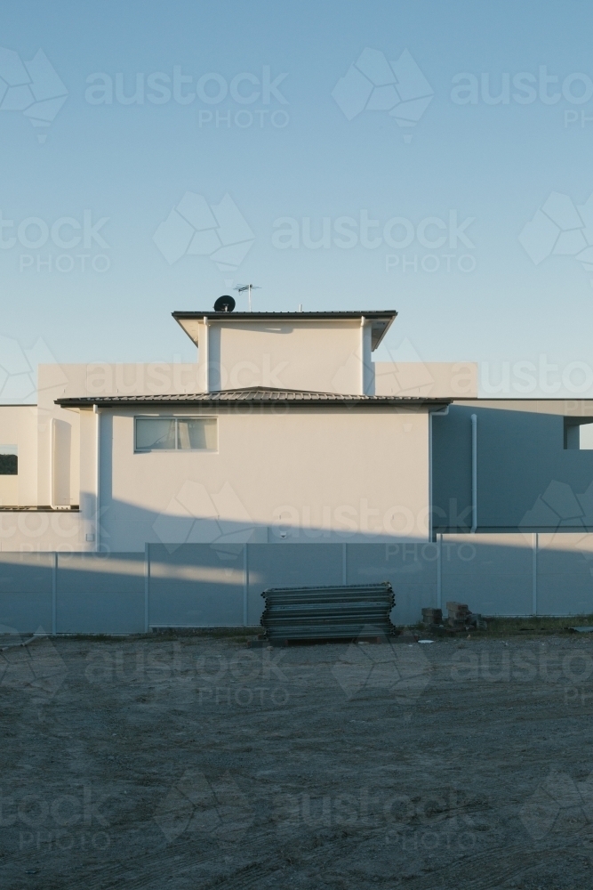 Suburban housing construction site and building equipment, evening light - Australian Stock Image