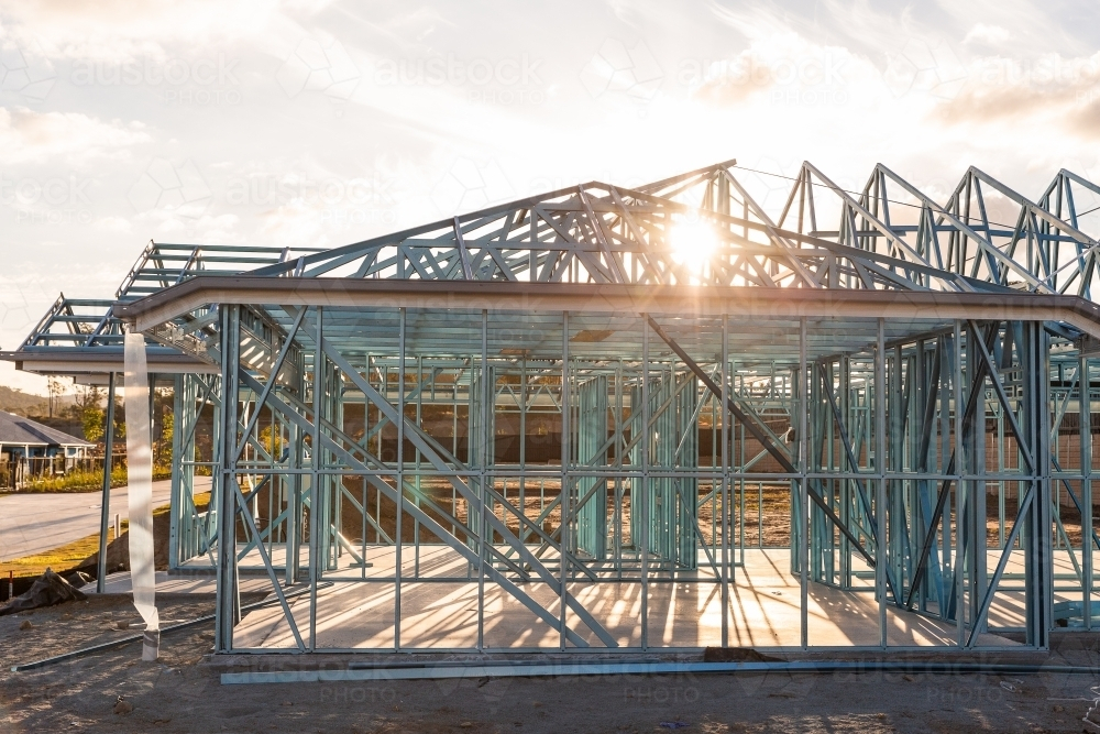 sunlight through the frame of a house being built near Brisbane - Australian Stock Image