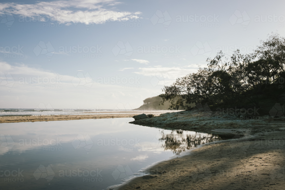 Sunrise over beach on Stradbroke Island in Queensland Australia - Australian Stock Image
