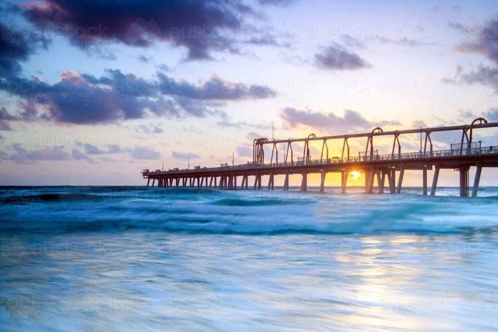 Image of Sunrise through the pier at The Spit in the Gold Coast ...