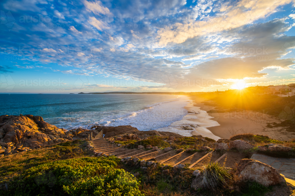 sunset above the Encounter Bay viewed across Boomer Beach, Port Elliot, South Australia - Australian Stock Image